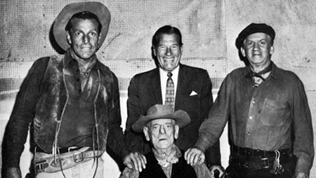 On the set of producer Alex Gordon’s “The Bounty Killer”. (L-R) Buster Crabbe, Richard Arlen, Fuzzy Knight, Broncho Billy Anderson seated. 