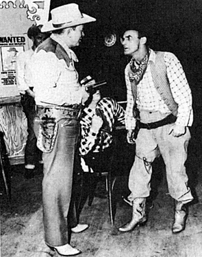 Tex Ritter on the Grand Ole Opry in the ‘50s with comedian Rod Brassfield. 