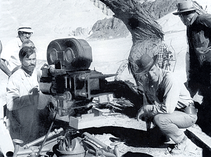 Shooting a scene for "The Professionals", cinematographer Conrad Hall (directly behind camera) and Burt Lancaster. 