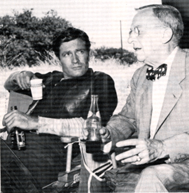 Hugh "Wyatt Earp" O'Brian relaxes on the set with Stuart Lake, consultant to the 
ABC-TV series, who lived with the real Earp prior to his death and gathering material for his best selling biography. 