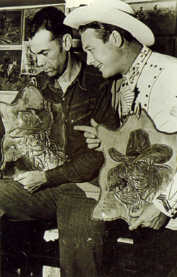 Artist Bob Brown shows Monte Hale some of his masterpieces carved in leather in 1949. 