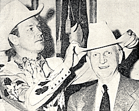 Rex Allen adjusts Indiana governor Henry Schricker's Stetson when Rex visited the Hoosier State House in 1950. 
