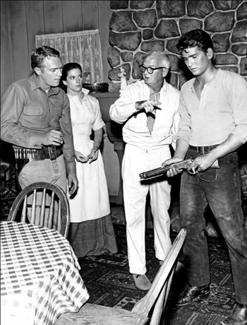 Director Tommy Carr sets up a scene for the first episode of "Wanted Dead or Alive: The Martin Poster" with (L-R) Steve McQueen, Jennifer Lea and Michael Landon. 