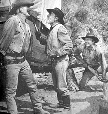 What the heck is "Wagon Train"'s Frank McGrath doing to Terry Wilson? Whatever it is, Denny Miller is getting a large laugh out of it. 