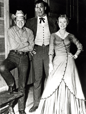 Clint Walker casts a shadow over Michael O'Shea and Virginia Mayo. 
O'Shea and Mayo were a married couple. 