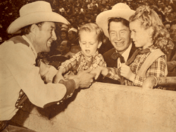 Wild Bill Elliott and Chill Wills with his children. 