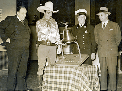 Tom Mix rings the bell for an unknown charity. 
