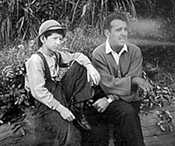 Tommy Nolan and Tennessee Ernie Ford on the set of TV's "Buckskin". Tennessee Ernie's production company made "Buckskin" which was done through Revue and filmed on the old Republic lot at Radford St. in Studio City, CA.