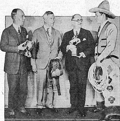 Yakima Canutt (right), in January 1930 while he was exhibiting some of his trophies in Toledo, Ohio. Local dignataries L-R: Harry Haskell, Ben Groenewold and Mayor William Jackson.