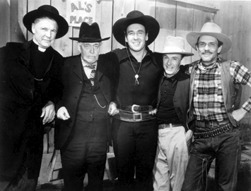 A candid shot on the set of “Gun Law” (‘38 RKO) with (L-R) Frank O’Connor as Parson Joshua Ross, Lloyd Ingraham as Pop Perkins, George O’Brien, Bob Burns as a townsman and Francis McDonald as henchman Nevada.