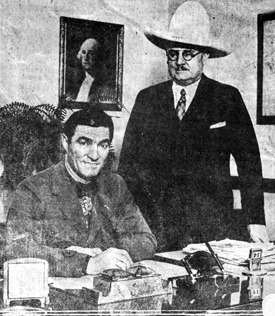 Toledo, OH, Mayor William T. Jackson welcomes Tom Mix to his office in April, 1929.