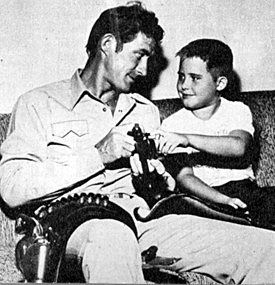 Jock Mahoney warns a youngster never to play with guns.