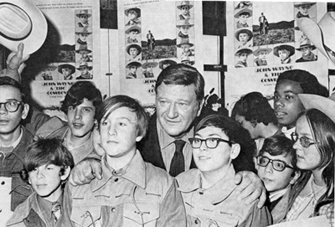 John Wayne and some of the 500 international winners of "The Cowboys" contest held for the Warner Bros. film in conjunction with it's world premiere at Radio City Music Hall in January 1972.