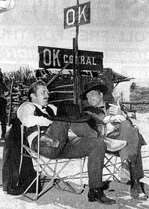Burt Lancaster as Wyatt Earp relaxes with co-star Kirk Douglas as Doc Holliday on the set of "Gunfight at the OK Corral" in 1957.