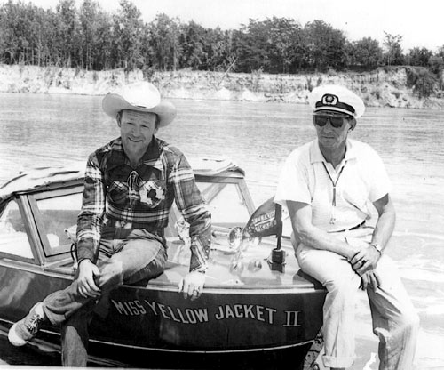 Down in Texas, Roy Rogers sits on his speedboat, Miss Yellow Jacket II. Roy was a part owner for awhile of the company which was in operation from 1949-1959.