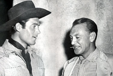 Clint “Cheyenne” Walker and Gary Cooper meet for a chat on the Warner Bros. back lot.