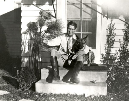 One of the top silent screen cowboys, Art Acord, at home with his dog. Circa late ‘20s.