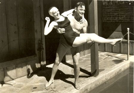 Buck Jones has a little poolside fun with leading lady Ruth Coleman between takes of “Headin’East” (‘37). 