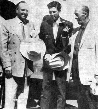 Gene Autry and Jimmy (Tagg Oakley of “Annie Oakley”) Hawkins are greeted by C. A. “Frenchy” Paquin (right) as they arrive in Sault Ste. Marie, MI, on August 16, 1958 for a show at Pullar Stadium. (Photo courtesy Jimmy Hawkins.)