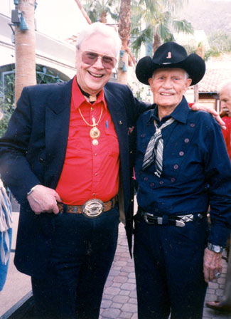Monte Hale and badman Pierce Lyden pose for a moment at a Palm Springs event.
