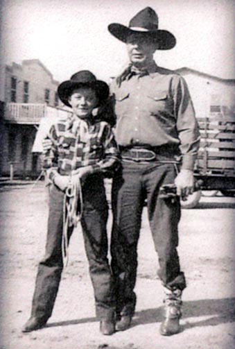 Eleven year old Don Stewart with Hoot Gibson on the back lot while making the Trail Blazers' "Wild Horse Stampede" ('43 Monogram). Don, born Dec. 23, 1931, in Tulsa, Oklahoma, moved with his family to California as a youngster. He attended William S. Hart High School and graduated from Glendale College with a degree in art. After his three films ("Wild Horse Stampede", "Arizona Whirlwind" with the Trail Blazers in '44 and "Where Trails End" in '43 with Tom Keene) Don became a successful artist and owned a flower and gift shop in Newhall, CA, where he was well known for his art and unusual floral designs. Don fought in the Korean War and later died at 49 in Corpus Christi, TX, while on a hunting trip with friends. According to Don's sister-in-law, Barbara Stewart of Modesto, CA, "Don went down in the yacht to have a nap between trips to the islands and simply didn't wake up." As a bit of trivia, as a child, Don's brother Joe (12 years younger than Don) was on June Lockhart and Eleanor Powell's "Faith of Our Children" on NBC ('53-'55) produced by Glenn Ford.  