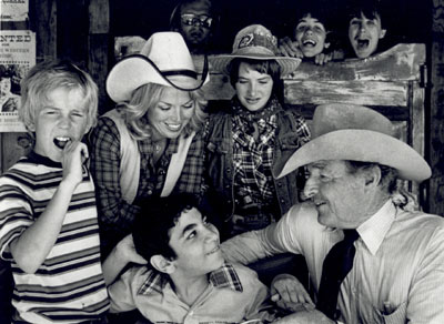 Low budget B-western star Johnny Carpenter at his Heaven On Earth Ranch which benefitted handicapped children. Photo was taken for "Hour Magazine" TV series for September 26, 1980. Co-host Pat Mitchell in the white hat.