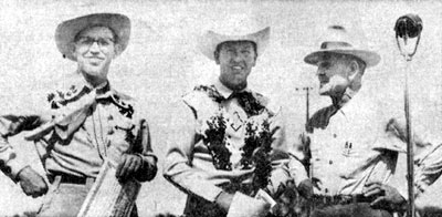 Rex Allen at the Dodge City, KS, Boot Hill Fiesta Rodeo in May 1952. On his left is Harry G. Wiles, state president of the Junior Chamber of Commerce. On his right is Sheriff Claude Dowdy.