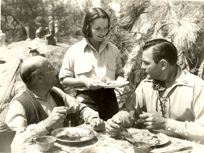 Harvey Clark, Louise Brooks and Buck Jones have a bite to eat on the set of Universal’s “Empty Saddles” (1936).