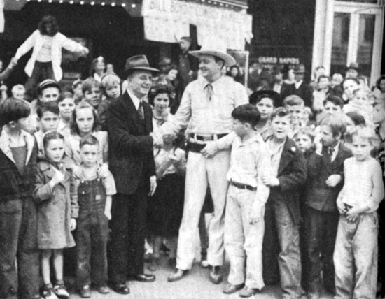 PRC’s “Cowboy Rambler” Bill Boyd meets with a group of his fans in 1942.