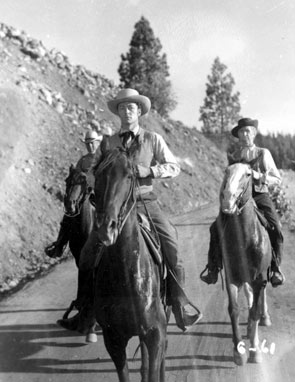 Candid shot of Tim Holt and Russell Simpson from “Gold is Where You Find It”  (‘38 Warner Bros.).