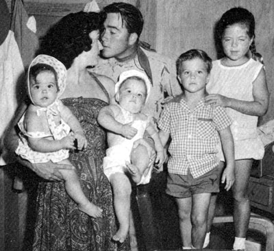 Dick Jones (“Range Rider”) and family circa 1958. Dick’s wife Betty holds the twins, Jennafer and Jeffrey, as Dick looks for a kiss. Beside them are Rick and Melody.