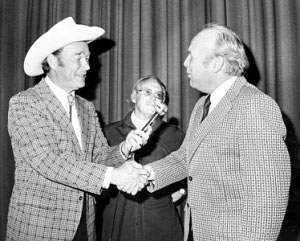 Roy shakes hands with Salisbury, NC, mayor Bill Stanback as Roy received the key to the city at the Terrace Theater in 1975.
