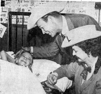 While appearing at the Mid-South Fair in Memphis, TN, in Oct. 1959, Roy and Dale brought a big smile to the face of 9 year old Ralph Dobbins, a patient at St. Joseph Hospital.