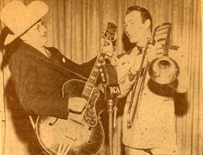 Roy swaps instruments with Tommy Dorsey during an NBC radio show in 1946.