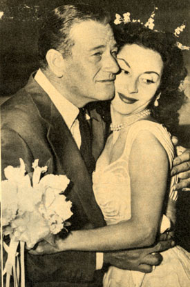Hawaiian leis became bridal wreaths for John Wayne and Pilar Palette in November 1954.