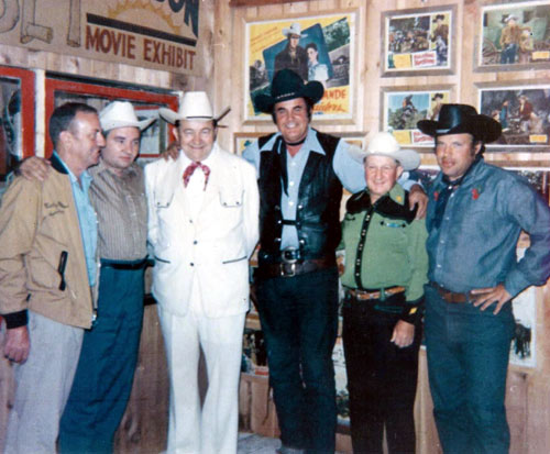 (L-R) Hal Miller,, cartoonist Max Harrison, Tex Ritter, Sunset Carson, Tex Barr and Jerry Whittington in Hal Miller’s Windy Hollow museum.