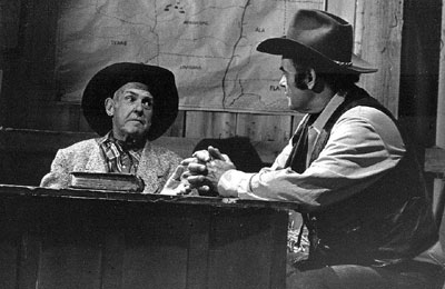 Texas Ranger Ken Maynard talks with the “Marshal of Windy Hollow”, Sunset Carson.