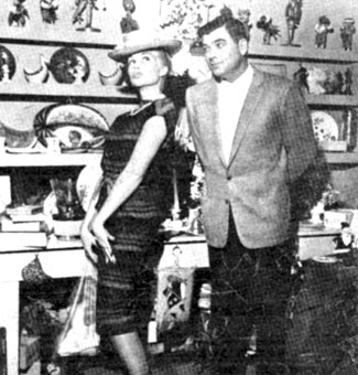 John Bromfield, star of TV's “Sheriff of Cochise” and “U. S. Marshal” watches wife Larri Thomas try on a funny hat in a Mexican curio store in 1959.