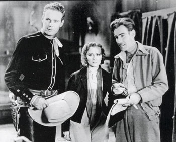 Lane Chandler and Doris Hill get some direction from Oliver Drake on the set of “Texas Tornado” (‘32 Kent).