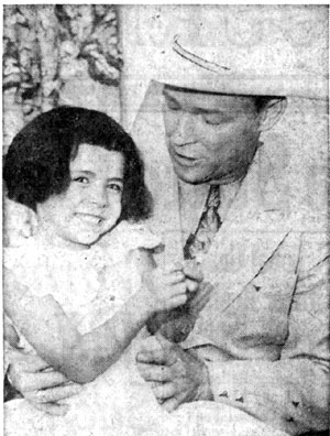 Roy Rogers and four and half year old daughter Debbie at a press conference for the September 1957 New Mexico State Fair in Albuquerque, NM.