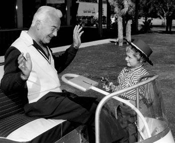 A young buckarette gets the drop on William “Hopalong Cassidy” Boyd. (Thanx to Bobby Copeland.)