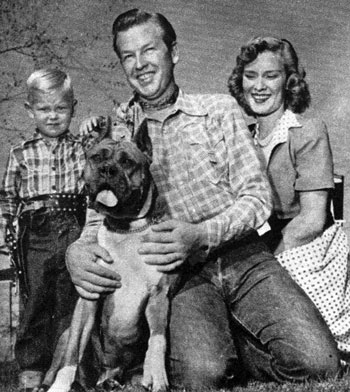 The Rex Allen family in August 1951. (L-R) Rex Allen Jr. aka Chico, Butch the Boxer, Rex and wife Bonnie. (Thanx to Jimmie Covington.)