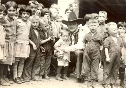 Buck Jones in 1928 visiting St. Joseph’s Foundling Home in Scranton, PA. Buck was in Scranton from May 21-23, 1928 performing at the Capitol Theatre. Before leaving the home Buck arranged with the Sisters for an ice cream party for all the children. (Thanx to Jerry Whittington.)
