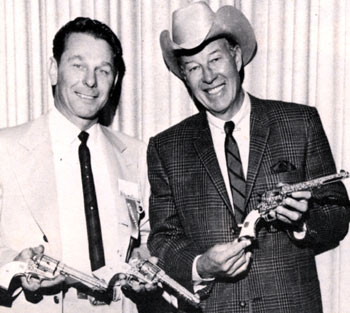 Noted arms writer and collector Tommy Bish with Bill Elliott displaying a trio of engraved Colts which Bish purchased at a gun show in ‘63. Elliott authenticated the fact he had owned the presentation .45s in the ‘50s.