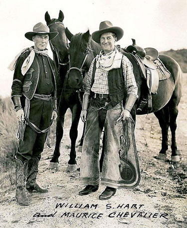 Possibly the only photo ever taken of musical star Maurice Chevalier in western duds alongside silent screen western great William S. Hart. (Thanx to Jerry Whittington.)