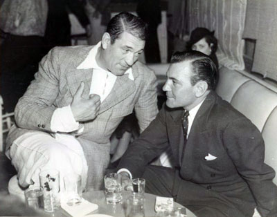 Discussing the business over a couple of drinks in 1936 are Victor McLaglen and Buck Jones. (Thanx to Bobby Copeland.)