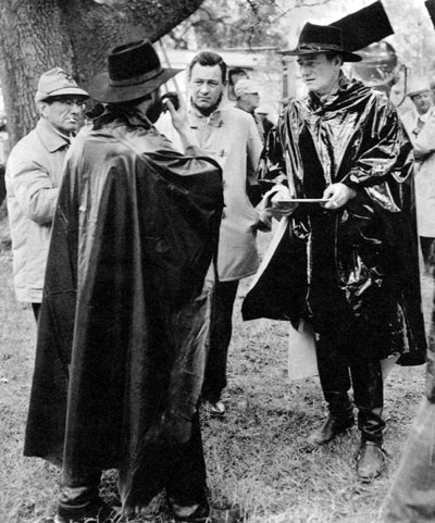 Setting up a scene in “The Horse Soldiers” are (L-R) unknown, possibly Stan Jones as General Grant, William Holden and John Wayne.