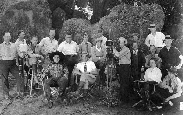 Ken Maynard, director Spencer Gordon Bennet (seated) and their Larry Darmour/Columbia Pictures production crew in 1936. (Thanx to Jerry Whittington.)