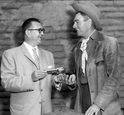 Randolph Scott with Fred Roff Jr., president of Colt’s Firearms Manufacturing Co.