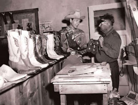 Rex Allen with noted Hollywood bootmaker Charlie Garrison. Garrison, who died in 1955, was a well known bootmaker in the San Angelo, TX, area before moving at the close of the ‘30s to Los Angeles where he became popular for his intricate boots. He soon became associated in business with Roy Rogers, doing special order bootwork for the short lived Roy Rogers Ranger Posts. Garrison went out on his own following the collapse of Rogers' western stores. Garrison later left California and ran a boot shop in Llano, TX. (Photo thanx to Jerry Whittington.)